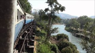 A train crosses the Wampo Viaduct along the River Kwai