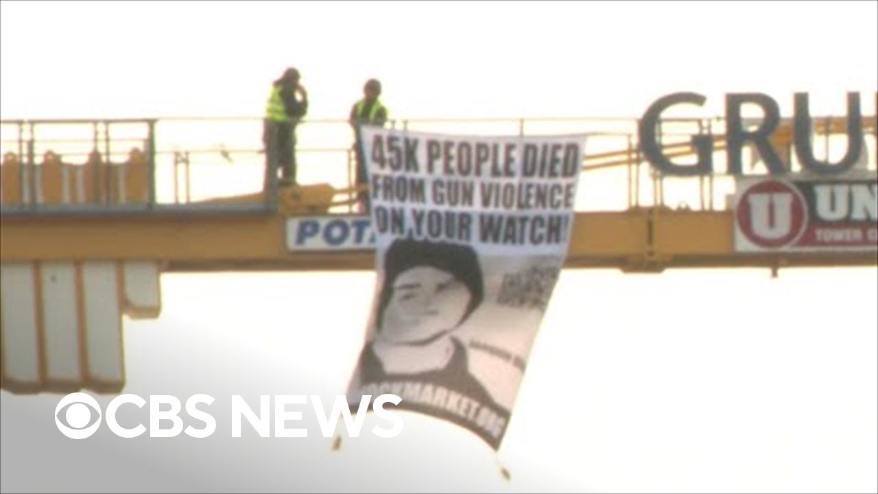 Parkland father climbs crane with message for Biden on anniversary of shooting