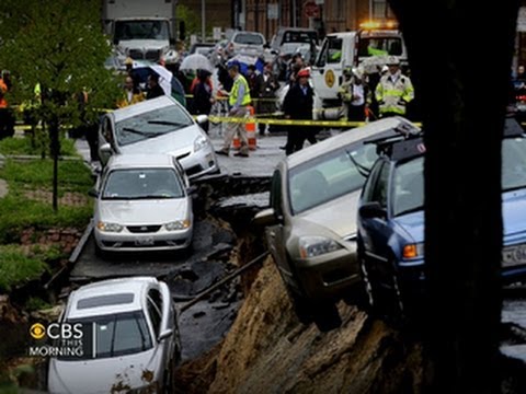 Street collapse in Baltimore sends parked cars tumbling