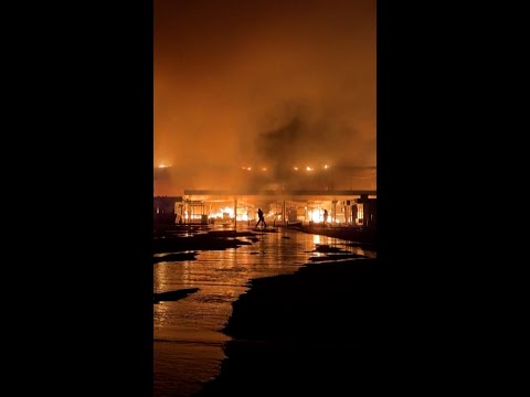 Ukrainian mall engulfed in flames after Russian attack
