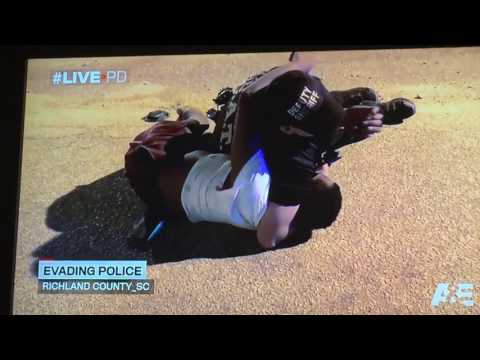 LIVE PD - Man flips car then fights cop while holding his baby