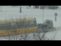 Снегопад Киев. Трактор вытаскивает трамвай из снега 