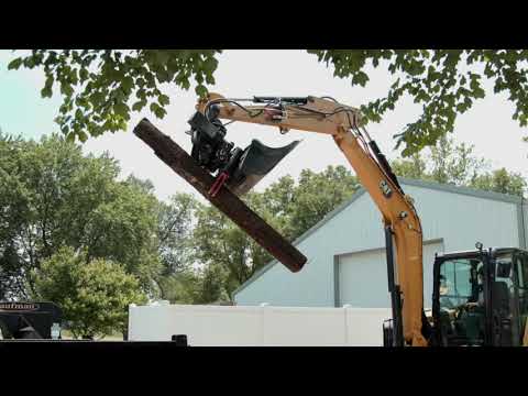 Cat® TRS6 Tiltrotator and Grapple at Work