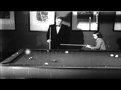 Little billiard player Jean Balukas pots the balls in billiard game and smiles in...HD Stock Footage