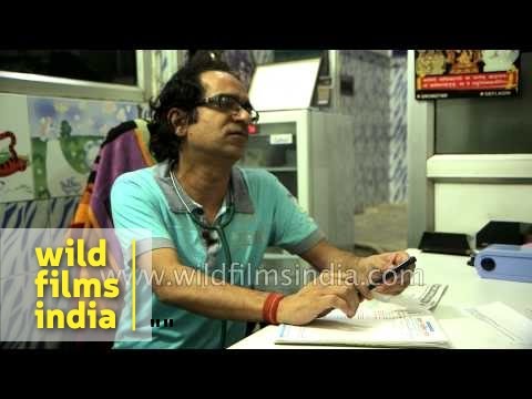 Indian Pediatrician auscultates chest of child patient