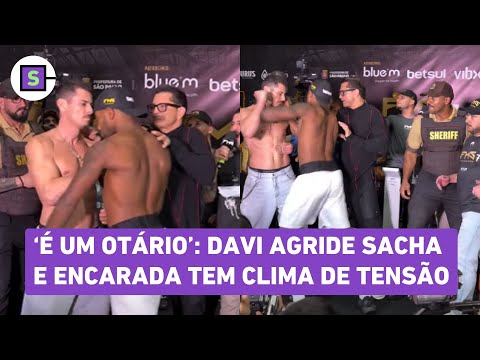 Davi Brito pushes and slaps Sacha Bali in the face during a 'face-off' on the Fight Music Show; w...