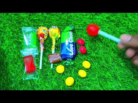 Satisfying video Asmr | rainbow lollipops | chocolate eating video | candy unboxing video Asmr