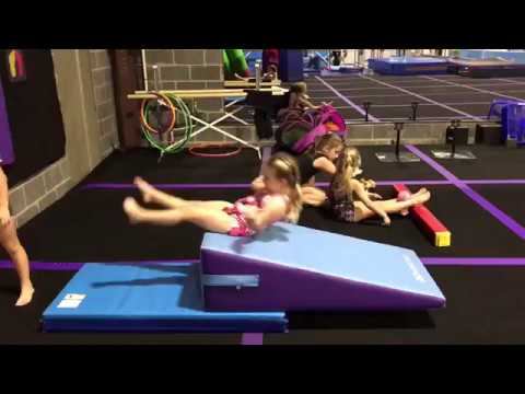 How To Coach Beginner Tumbling: The Backward Roll thumbnail