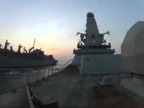 Destroyer, HMS Dragon, carries out a Replenishment at Sea with the USNS Rainier