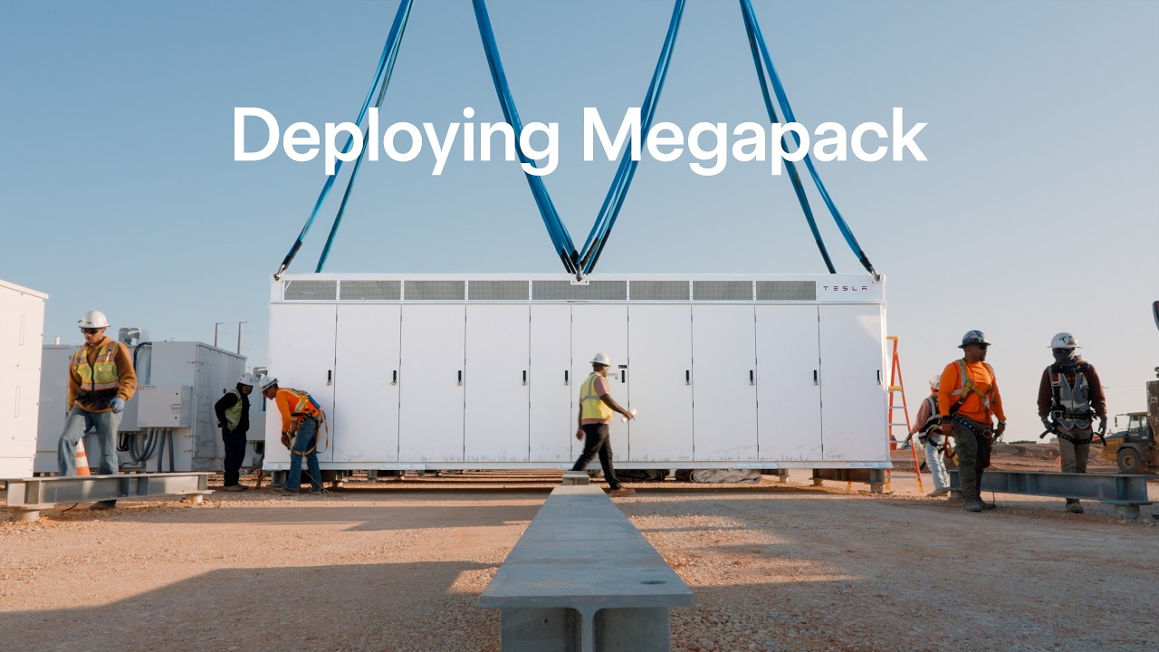 Tesla Megapack units being craned into position at a grid storage site