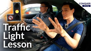 Driving Instructor Teaching a Pupil to Deal with Traffic Lights in Great Britain