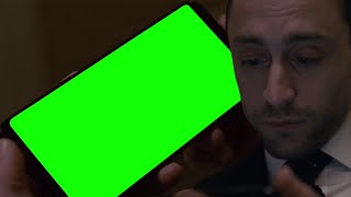 Succession Roman Roy checking his phone in the bathroom green screen