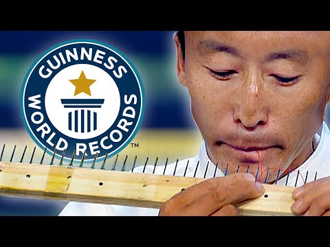 Most Needles Threaded With The Mouth - Guinness World Records