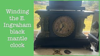 Winding the E. Ingraham black mantle clock
