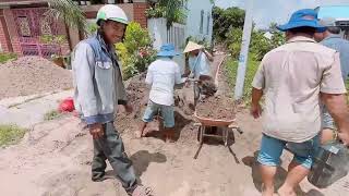 Part 2: Making Roads: Unexpectedly, the Mason did this in the rain: pouring the Da da and then po...