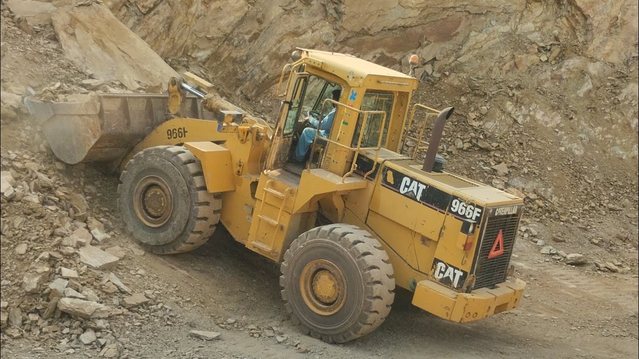 Massive Rock Blast and Load: Caterpillar 966F's Mighty Performance