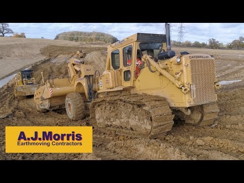 A.J.Morris Building a Reservoir with Cat Dozers