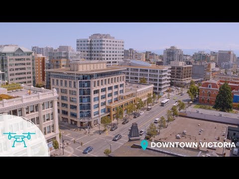 Flying through the city of Victoria BC - 4k