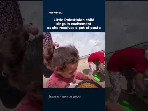 Little Palestinian child sings in excitement as she receives a pot of pasta
