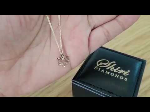 A video of Real Gold 0.015 ct Diamond Solitaire Accent Star of David Pendant