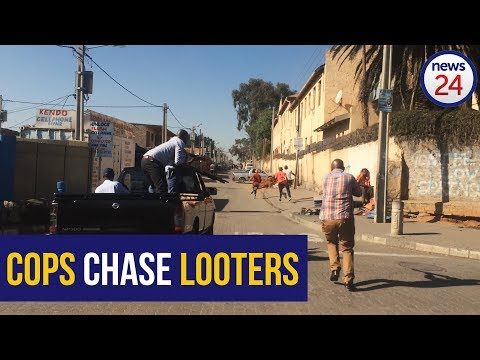 WATCH | Police give chase, fire rubber bullets as Alex looters flee destroyed shops