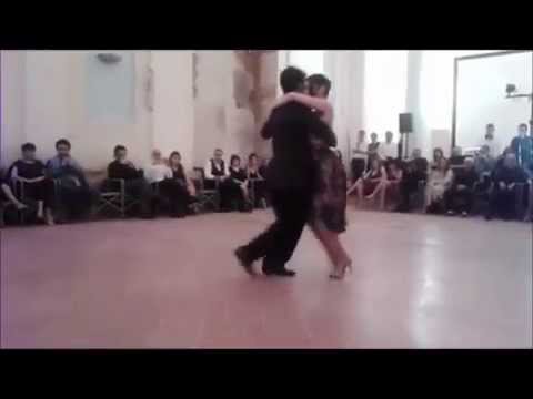  Cristhian Sosa  and  Melina Mouriño  are  dancing  to  a  tango  at  Perugia Tango Festival  in  2014