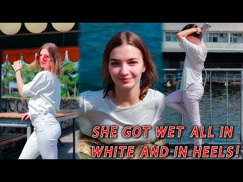 She got wet all in white and in heels! Looked hot wetlook