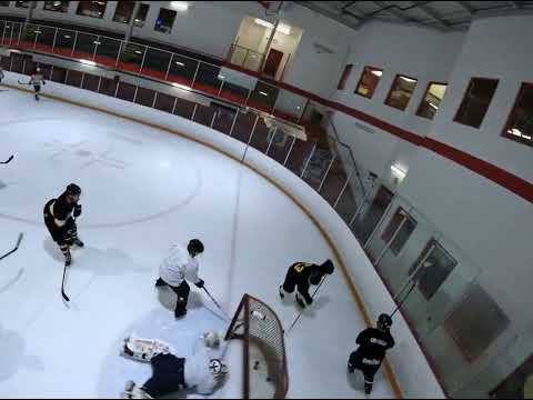 FPV drone flying over a hockey practice