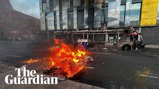 Bus and cars burned in anti-immigration protests in Belfast after stabbing