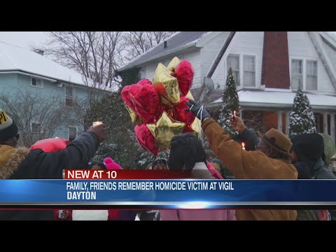 Family, friends remember 23-year-old homicide victim at vigil