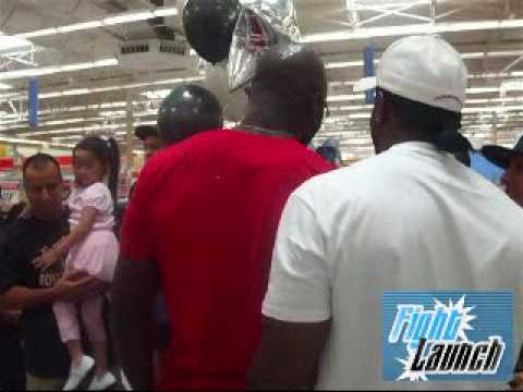 UFC Fighter Paul Kelly signs the back of Cheick Kongo's Head - UFC 100