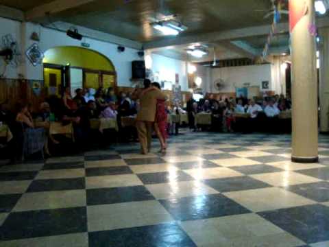  Enzo Hoces  and  Mirna Laza Moreno  are  dancing  to  a  tango