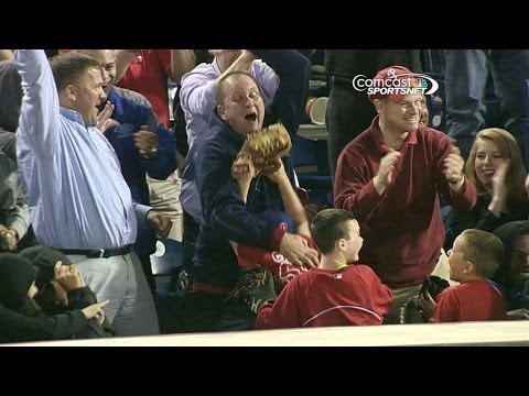 Father and son go wild after son catches ball