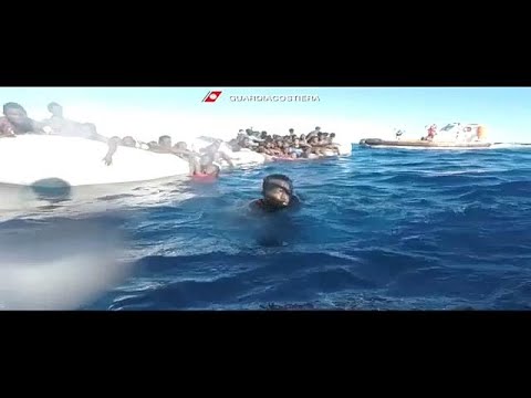 Italy's coast guard rescues scores of migrants off Libyan coast
