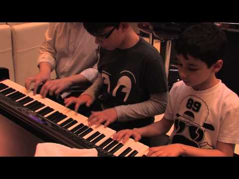 Beethoven, AC/DC and a Cleaner. Watch The Three Piano Musketeers in action.