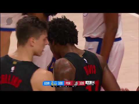 Ed Davis fights through 3 warriors players to get the offensive rebound.