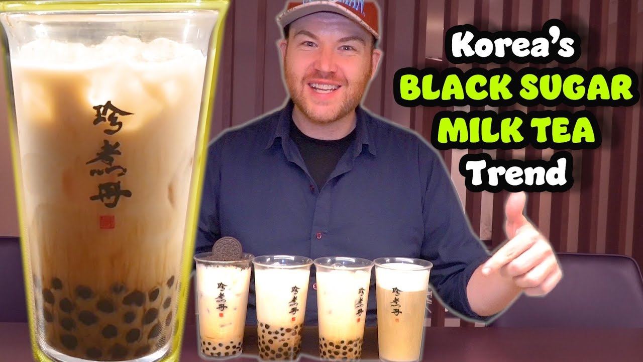 A Korean brown sugar boba milk drink with dark caramel sugar streaks visible against the white milk and chewy tapioca pearls