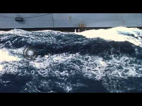 USS Pollux alongside USS Constellation at Yankee Station, Gulf of Tonkin, Vietnam...HD Stock Footage