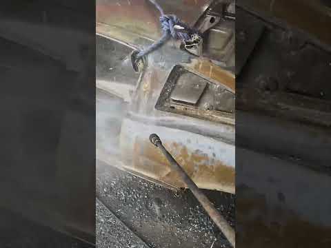 Pulling this 1965 mustang fastback out of  the acid and then pressure washing all the rust off.