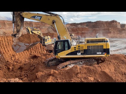 Caterpillar 365C Excavator Loading Trucks