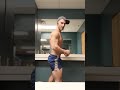 Back workout posing post training - bodybuilding men's physique flexing