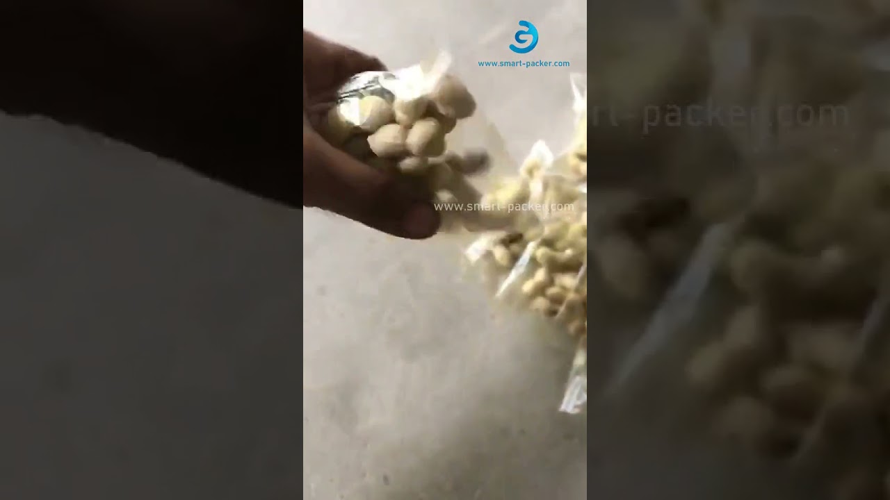 High speed dry peanut vertical cup dosing filling bag packaging machine testing video