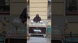 Man Plays Music with Crystal Glass on Street - 1498917