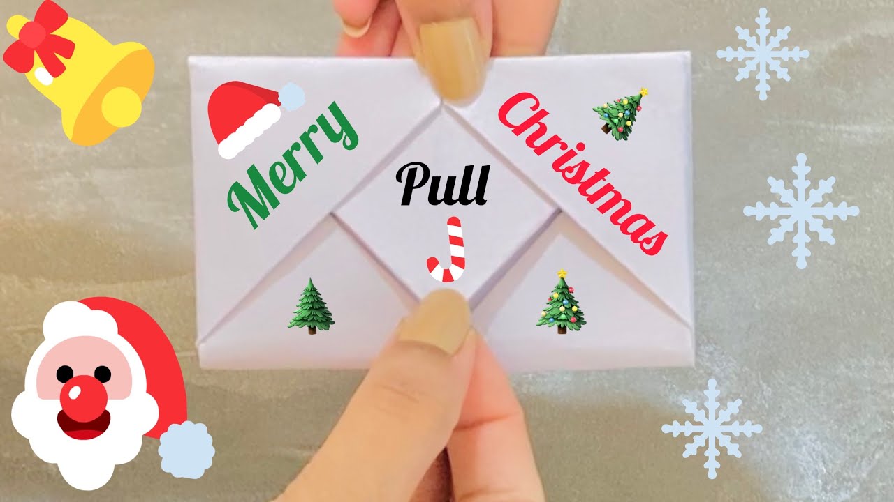 Watch video Pull tab origami envelope card for Christmas 🎄|Surprise message card for Christmas |Origami card Now Pull tab origami envelope card for Christmas 🎄|Surprise message card for Christmas |Origami card