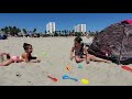 Kids Are Playing On The Beach With Sand And Having Fun