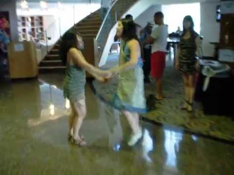 Two Girls Dancing Salsa In Public