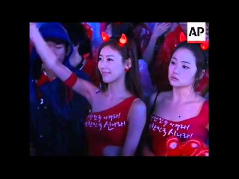 South Korean fans cheer on their team in match against Greece