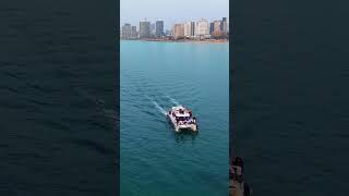 DJI Mini 5 Pro at sea #dji #drone #mini5pro #רחפן#sea #מים #waves #beach #Coastal city #people