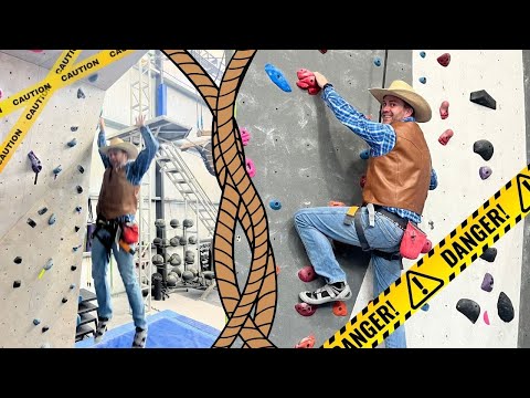 Two climbers in cowboy outfits scale an indoor rock wall; yellow DANGER tape frames the scene.