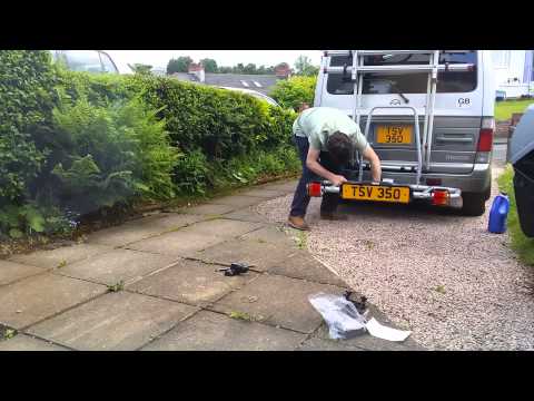 Putting the box on the Bongo.